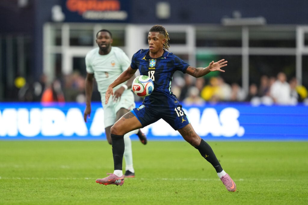 Danilo playing for Brazil, blue kit