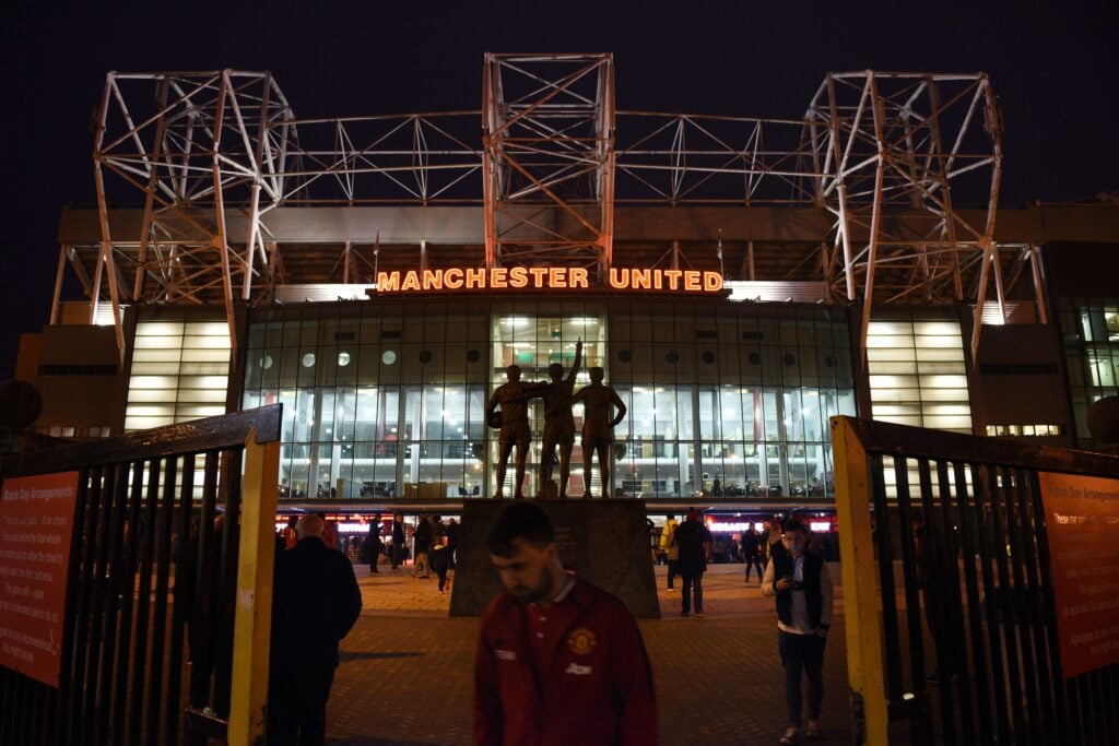 Exterior shot of Old Trafford at night