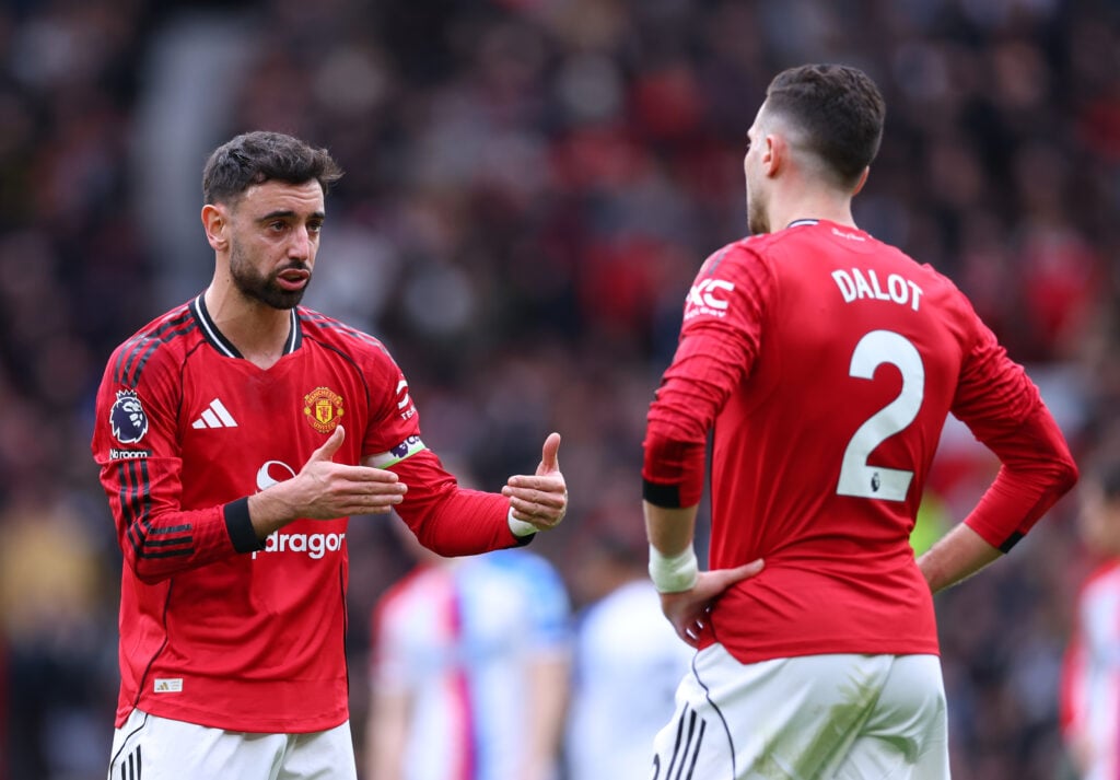 Bruno Fernandes interacts with Diogo Dalot during the Premier League match between Manchester United and Crystal Palace at Old Trafford on March 1, 2026, in Manchester, England.