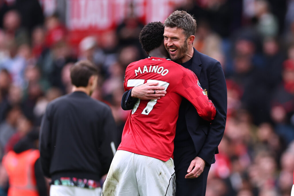 Michael Carrick hugging Kobbie Mainoo