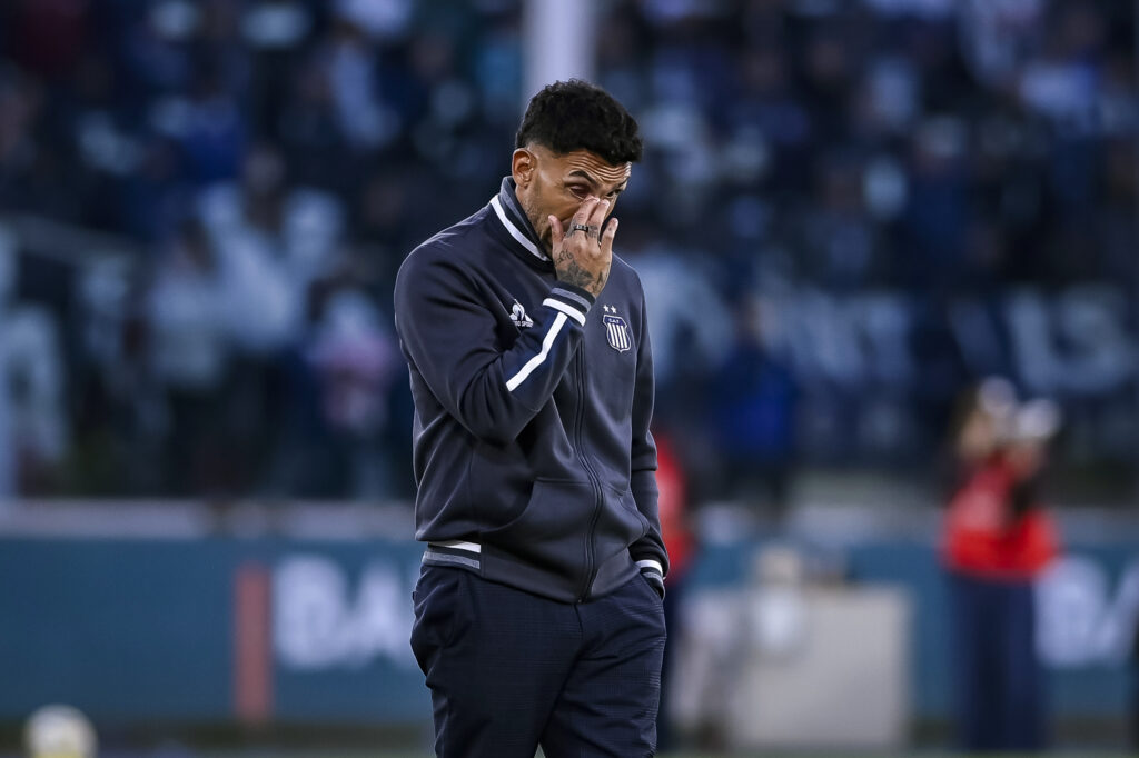 Carlos Tevez disappointed on the touchline against Belgrano