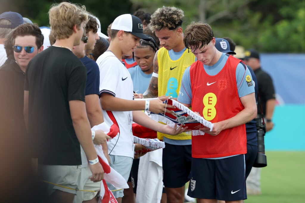 Alex Scott signs autographs after training with England