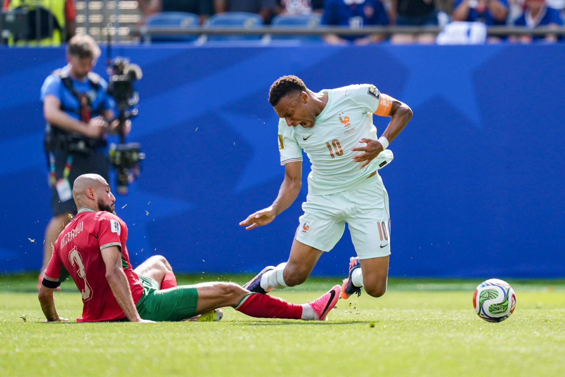 Noussair Mazraoui fouls Kylian Mbappe inside the box