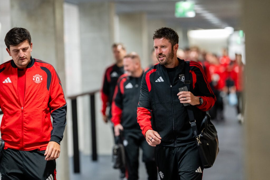 Michael Carrick chatting to Harry Maguire