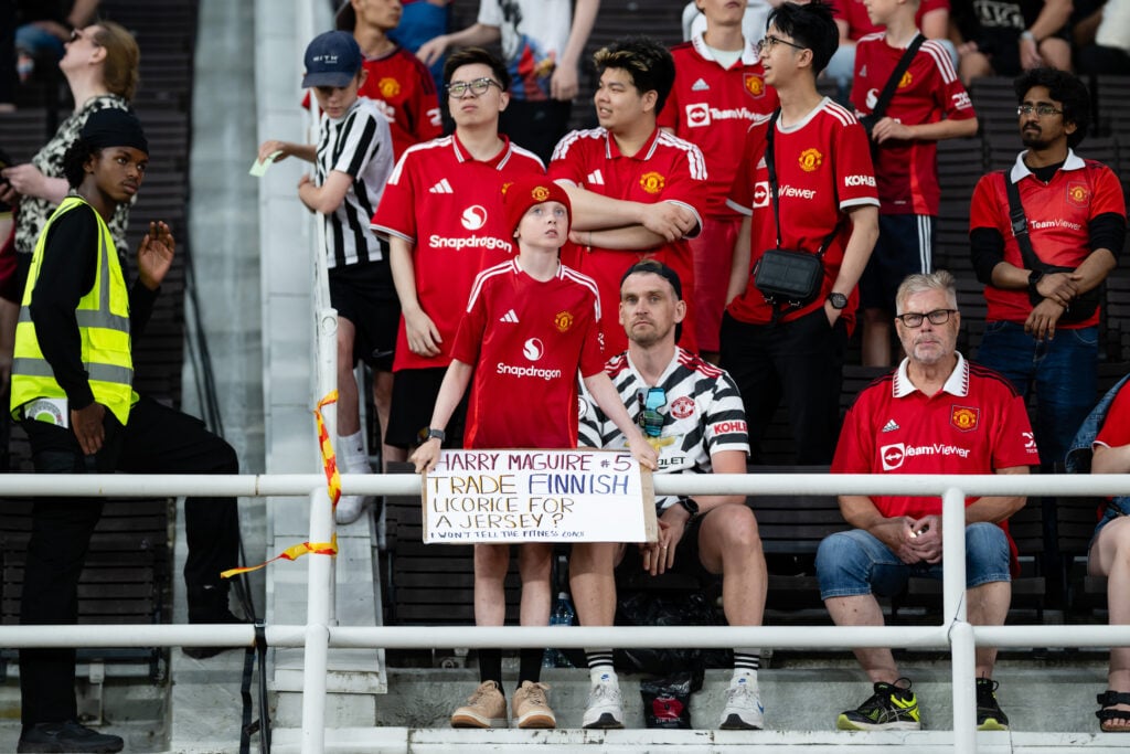 A young Manchester United fan with sign in Helsinki
