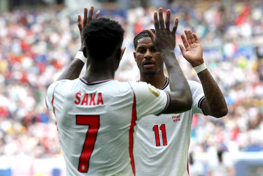 Marcus Rashford celebrates with Bukayo Saka